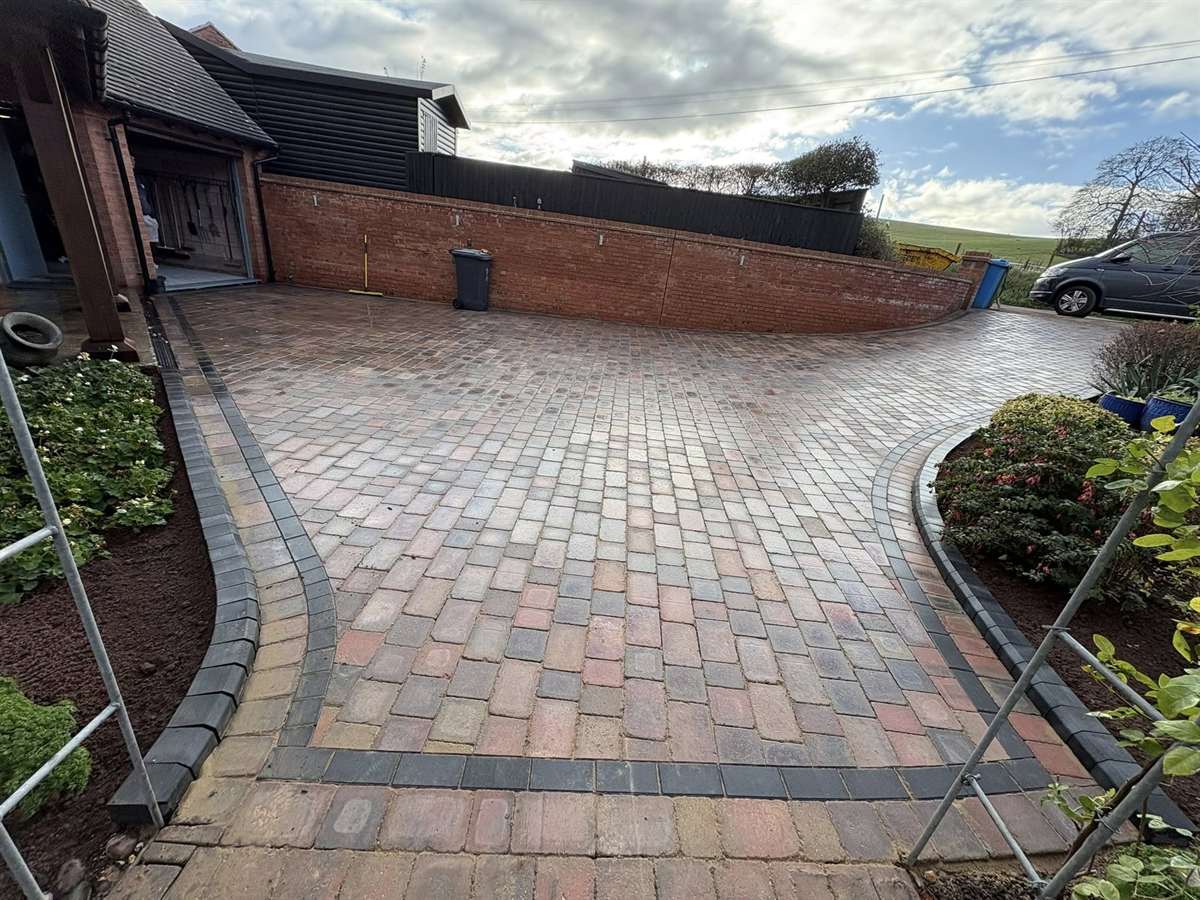 Block-paved driveway with charcoal border — building and landscaping in Kingswinford by Barker Building & Landscapes